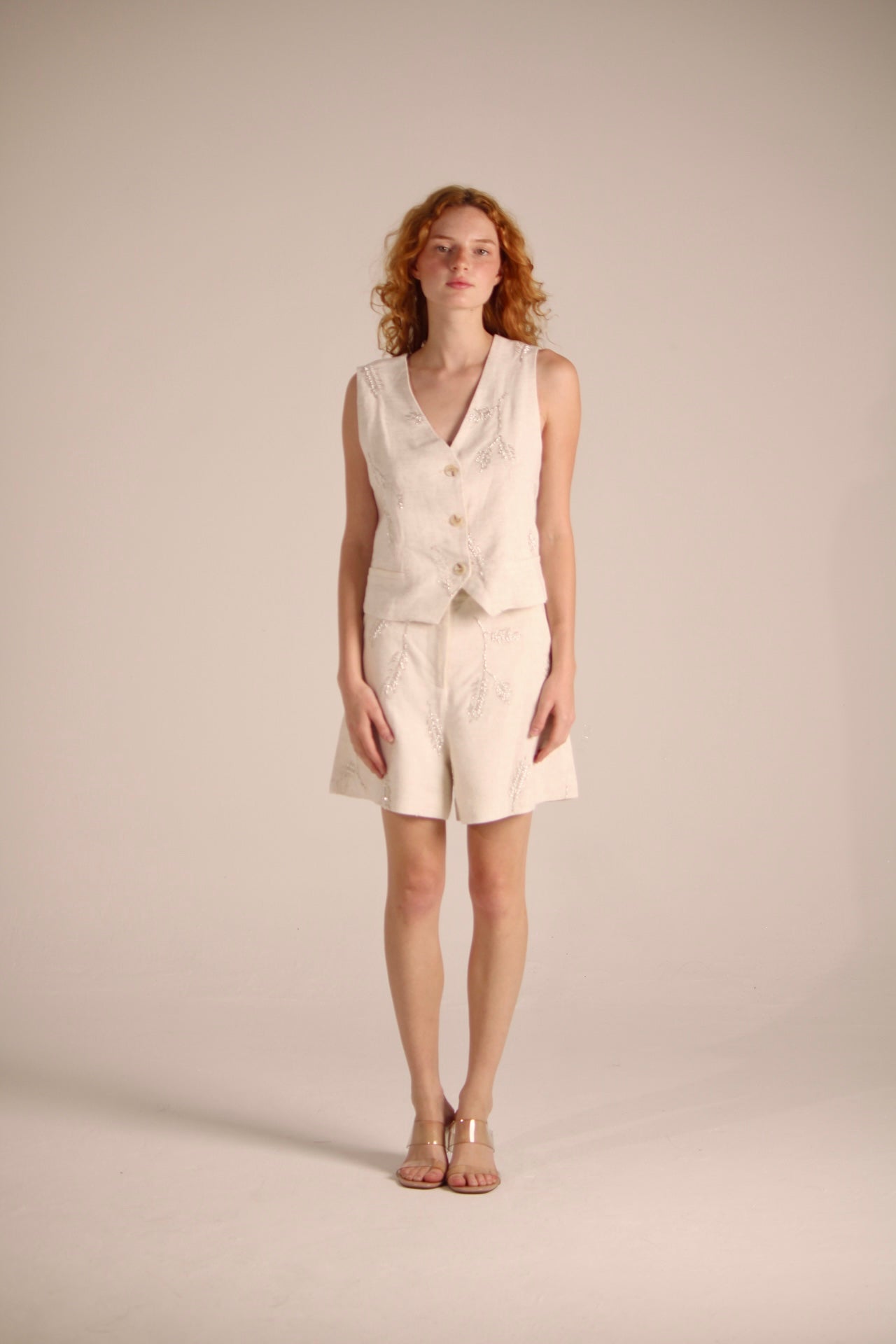 BEIGE VEST WITH FLOWER-SHAPED PEARLS